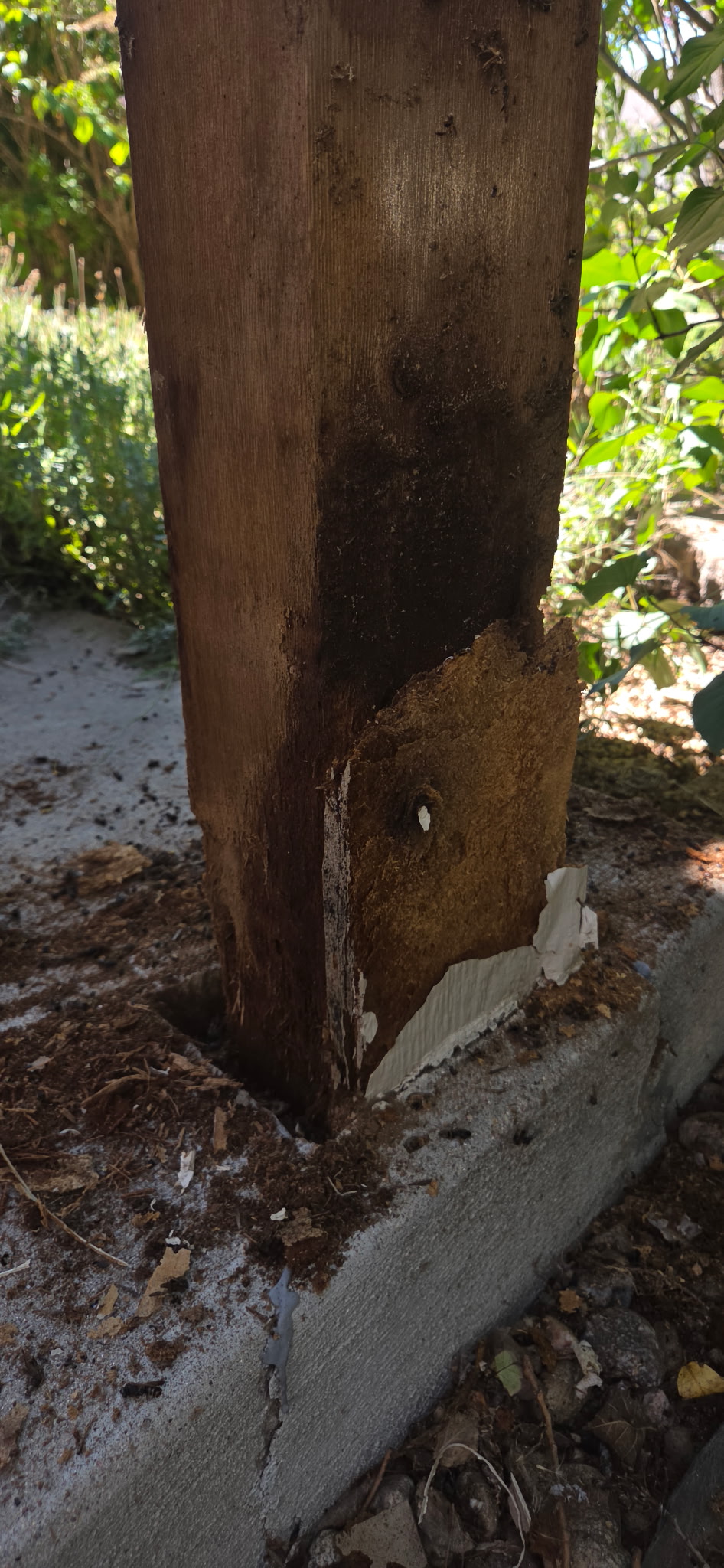 Before and after of a broken fence post repaired and reset straight by Bradley Johansen, All About Home Services